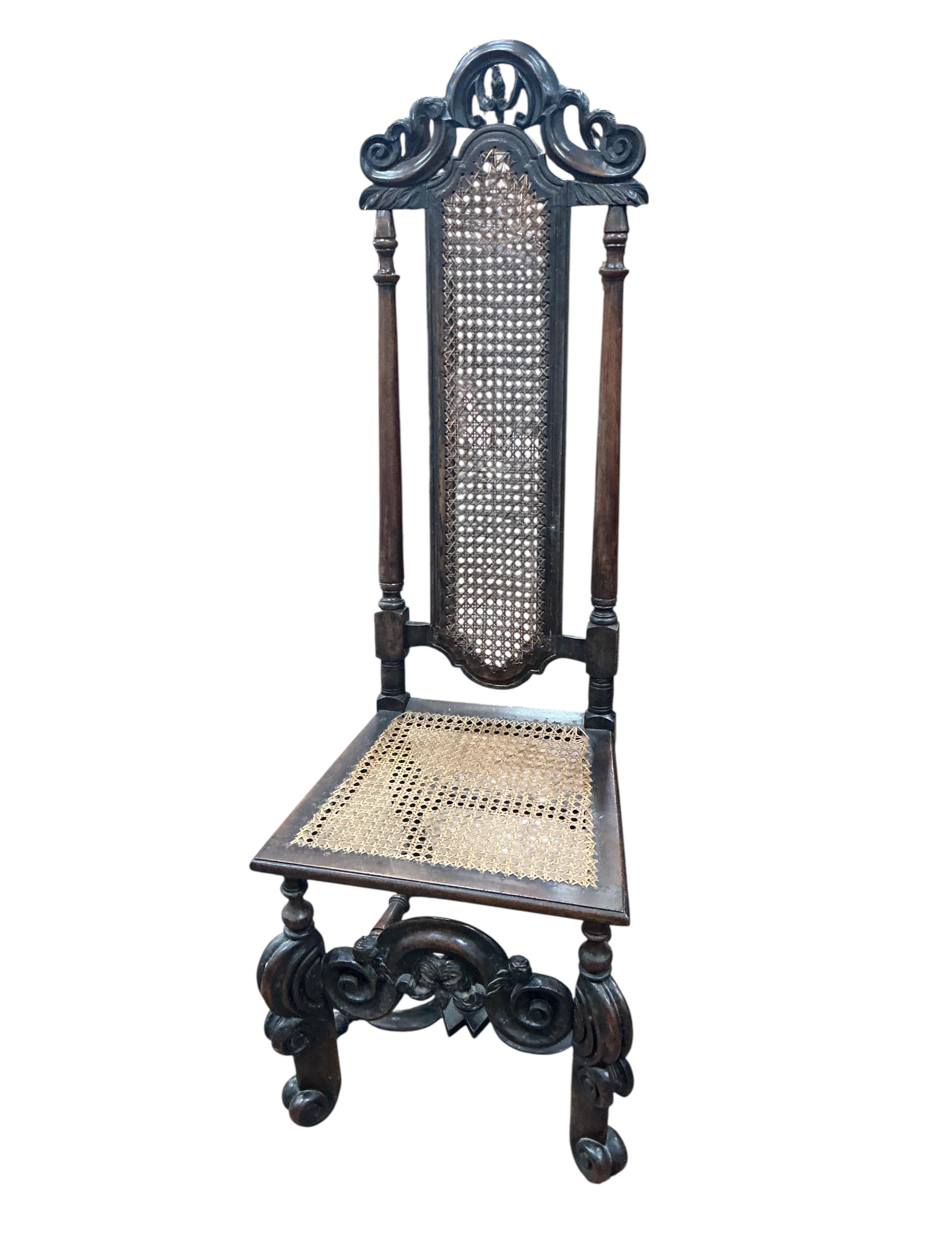 A pair of William and Mary walnut and cane work side chairs, width 46cm, depth 48cm, height 116cm